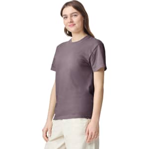 A heavyweight adult t-shirt in a muted purple colour, displayed on a model with a relaxed fit.