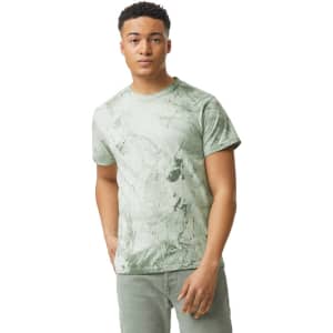 A green heavyweight T-shirt featuring a unique marbled design, shown on a male model. Includes a logo on the shirt.