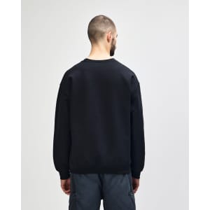 A black Gildan Heavy Blend adult crewneck sweatshirt, viewed from the back, paired with blue jeans.