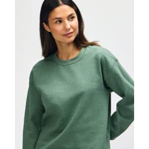 A green Gildan Heavy Blend adult crewneck sweatshirt, featuring long sleeves and a relaxed fit.
