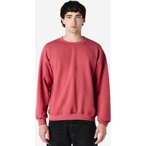 A red Gildan Heavy Blend adult crewneck sweatshirt displayed on a model, featuring a simple design and fitted silhouette.
