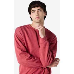 A crewneck sweatshirt in a rich red colour, featuring long sleeves and a relaxed fit. It has a logo on it.