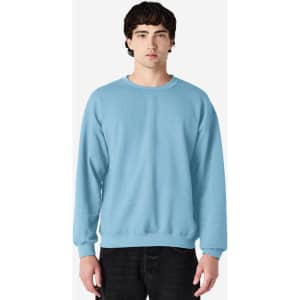A light blue Gildan Heavy Blend adult crewneck sweatshirt with a plain design and a logo.