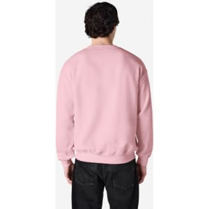 A pink Gildan Heavy Blend adult crewneck sweatshirt viewed from the back, featuring a simple design and a logo.