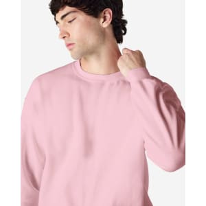 A pink Gildan Heavy Blend adult crewneck sweatshirt featuring long sleeves and a relaxed fit.