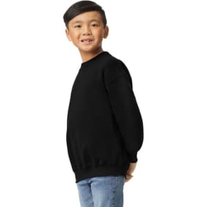 A youth sweatshirt in black, featuring a crew neck and long sleeves, shown worn by a smiling child.