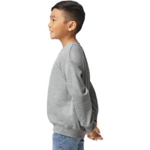 A grey youth sweatshirt is displayed, featuring long sleeves and a ribbed neckline. The model is positioned sideways.