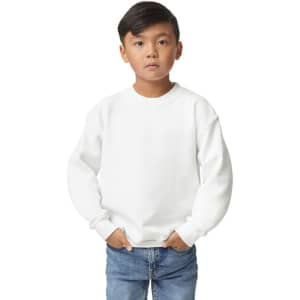 A youth sweatshirt in white, featuring a crew neck and long sleeves, held by a child with hands in pockets.