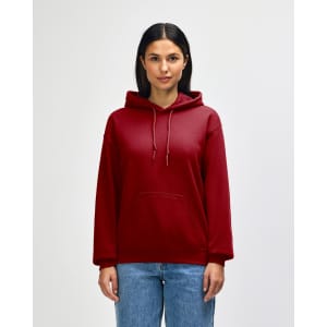 A red hooded sweatshirt with a front pocket and drawstring hood. The model is posed against a plain backdrop.