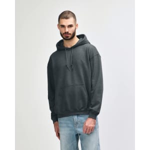 A grey Gildan Heavy Blend adult hooded sweatshirt displayed on a model, featuring a front pocket and a hood.