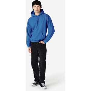 A blue hooded sweatshirt with a front pocket, worn by a model alongside black jeans and sneakers.