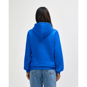 A blue Gildan Heavy Blend adult hooded sweatshirt viewed from the back, featuring a hood and a fitted design.