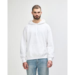 A white hooded sweatshirt with a front pocket and drawstrings, displayed on a model against a plain background.