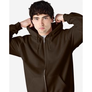 A brown Gildan Heavy Blend adult full zip hooded sweatshirt, featuring a front zipper and a model adjusting the hood.