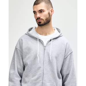 A grey adult full zip hooded sweatshirt with a front pocket and a hood, worn by a man.