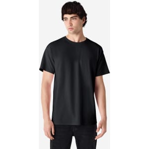 A black Gildan Ultra Cotton adult t-shirt on a model, featuring a simple design and casual fit.