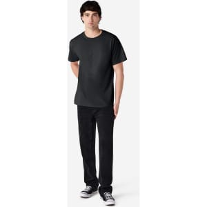 A black Gildan Ultra Cotton adult t-shirt displayed on a mannequin, paired with black pants and sneakers.