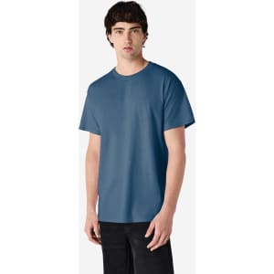 A man wearing a blue Gildan Ultra Cotton adult T-shirt, standing against a plain background.