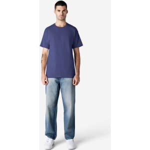 A purple Gildan Ultra Cotton adult t-shirt displayed on a model wearing light blue jeans and white shoes.