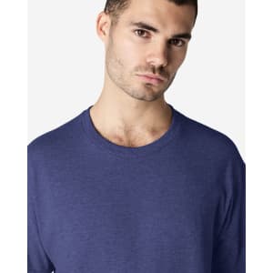 A model wearing a navy Gildan Ultra Cotton adult T-shirt with a crew neckline. The shirt has a logo on it.