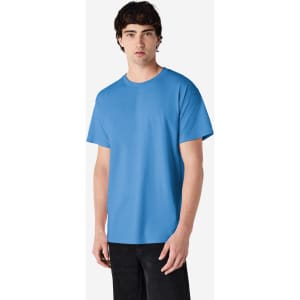 A blue Gildan Ultra Cotton adult T-shirt displayed on a model. The shirt features a logo and has a relaxed fit.
