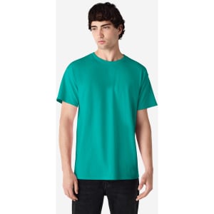 A teal Gildan Ultra Cotton adult t-shirt is displayed on a model standing against a plain background.