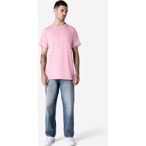 A pink Gildan Ultra Cotton adult T-shirt displayed on a model wearing black pants and sneakers, featuring a logo.
