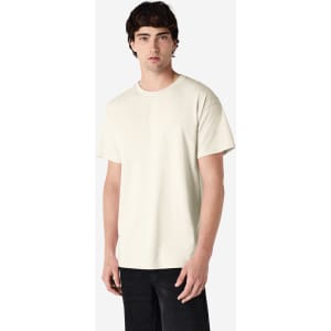 A plain cream Gildan Ultra Cotton adult T-shirt displayed on a model, featuring short sleeves and a round neckline.