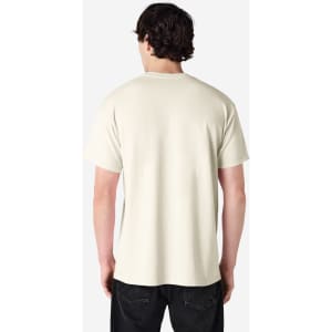 A plain beige adult T-shirt is displayed, featuring a crew neck and short sleeves. It has a logo on the back.