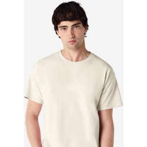 A light beige adult t-shirt with a classic crew neck and short sleeves, featuring a logo.