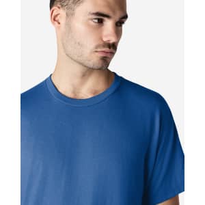 A blue Gildan Ultra Cotton adult T-shirt worn by a model, featuring a simple design and a logo.