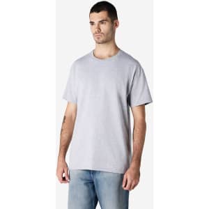 A grey Gildan Ultra Cotton adult T-shirt displayed on a model, featuring a basic crew neck and short sleeves.