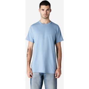 A light blue adult T-shirt on a male model, featuring short sleeves and a round neckline. It has a logo on it.