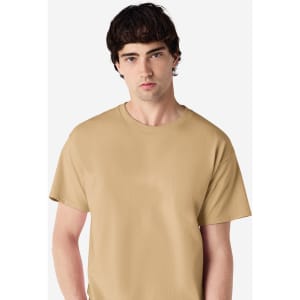 A tan Gildan Ultra Cotton adult T-shirt displayed on a model with a neutral background and a logo on the shirt.