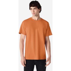 An orange Gildan Ultra Cotton adult T-shirt displayed on a model, featuring a round neck and short sleeves.