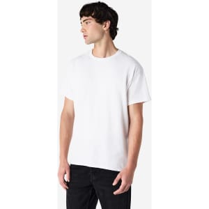 A white Gildan Ultra Cotton adult t-shirt displayed on a male model, featuring a logo on the front.