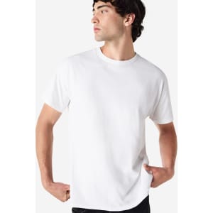 A white Gildan Ultra Cotton adult t-shirt on a model, featuring a simple design and a logo.