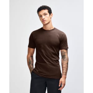 A unisex fine jersey short sleeve t-shirt in brown, featuring a simple design and a logo on the garment.