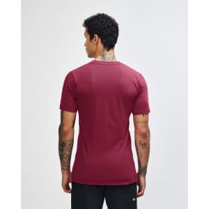 A maroon unisex short sleeve T-shirt with a plain back and a logo on the neckline.