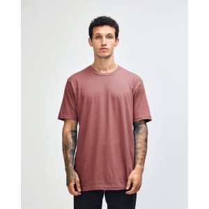 A unisex fine jersey short sleeve t-shirt in a pink colour, featuring a simple design and a logo on the front.