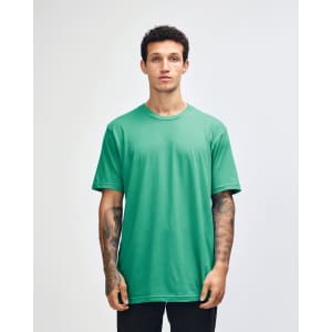 A light turquoise unisex short sleeve t-shirt worn by a model, featuring a logo.