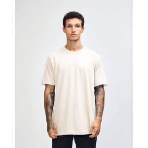 A unisex fine jersey short sleeve t-shirt in off-white, featuring a round neckline and relaxed fit.