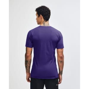A purple unisex short sleeve t-shirt, featuring a logo, displayed from the back on a model.
