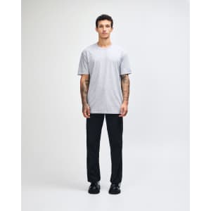A unisex fine jersey short sleeve T-shirt in grey, featuring a simple design and a logo.