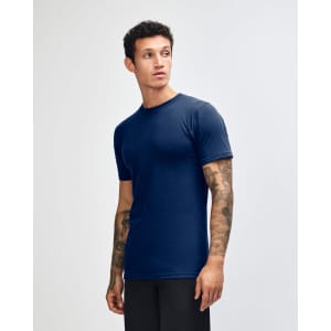 A side view of an American Apparel unisex fine jersey short sleeve t-shirt in teal. The model has curly hair.
