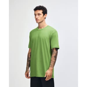 A green unisex short sleeve t-shirt displayed on a model from the side, featuring a branding logo.