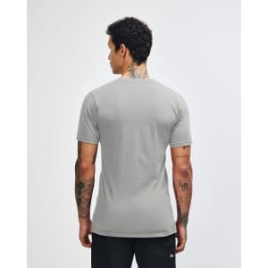 A grey unisex short sleeve t-shirt is displayed from the back, featuring a logo on the neckline.