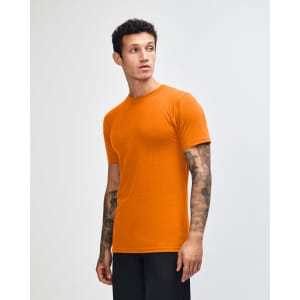 An orange unisex fine jersey short sleeve T-shirt, displayed from the side, featuring a brand logo.