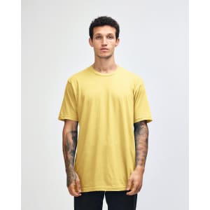 Unisex fine jersey short sleeve t-shirt in vibrant yellow, modelled by a person wearing blue jeans. Features a logo.