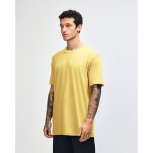 A yellow unisex short sleeve t-shirt displayed on a model from the side, featuring a simple design and a logo.